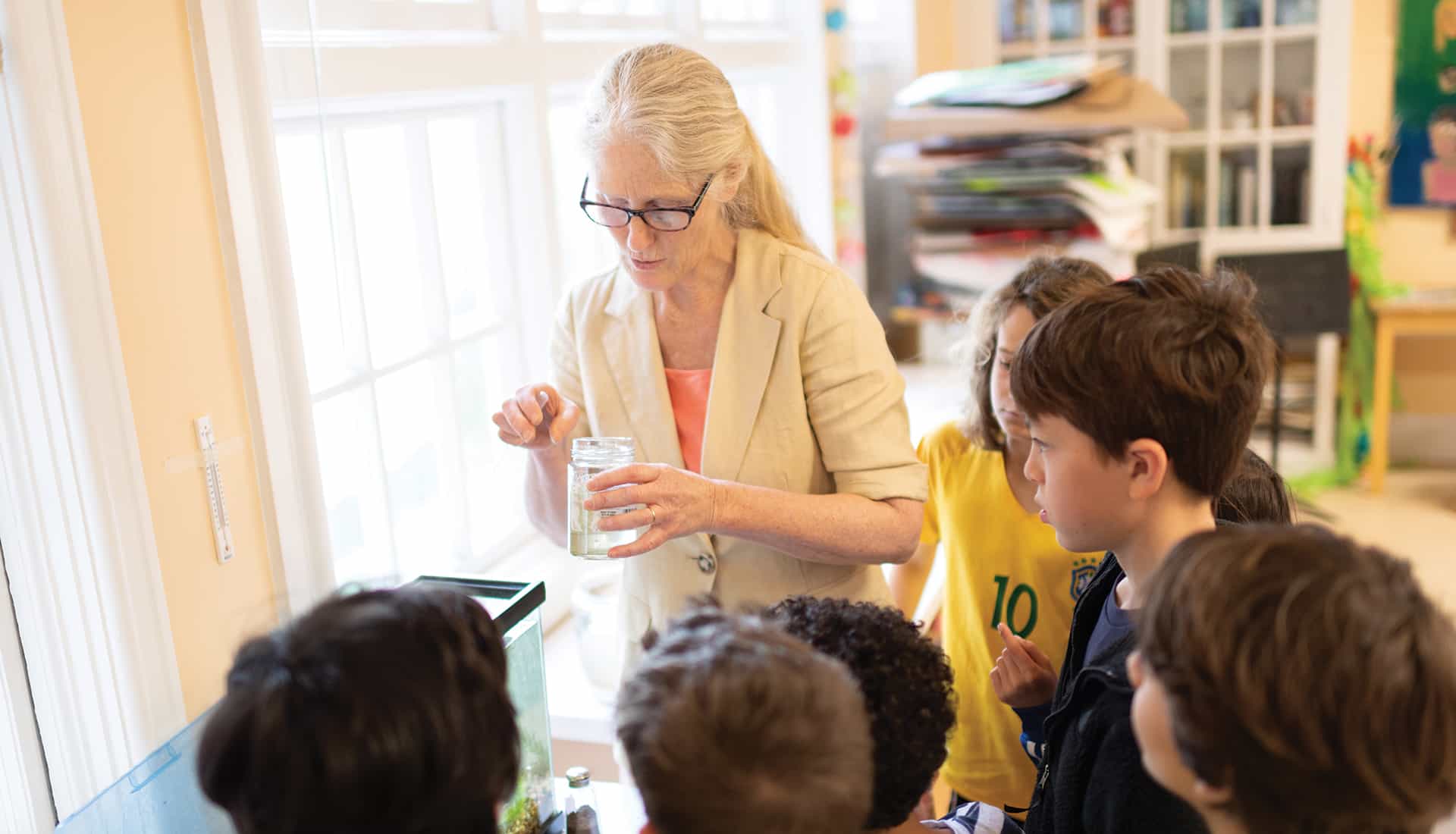 Science teacher and group of students