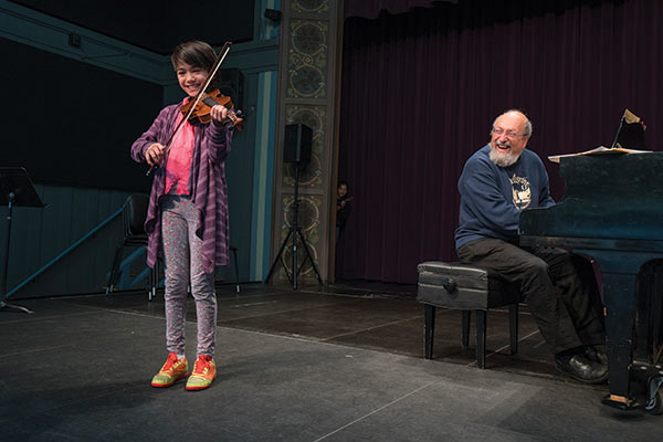 Student performing on the violin