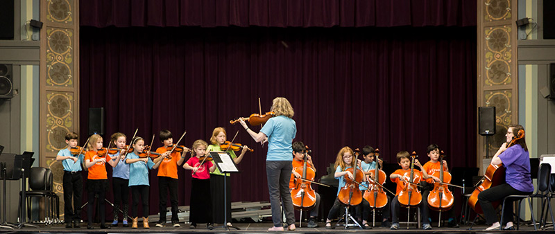 Teacher and strings class