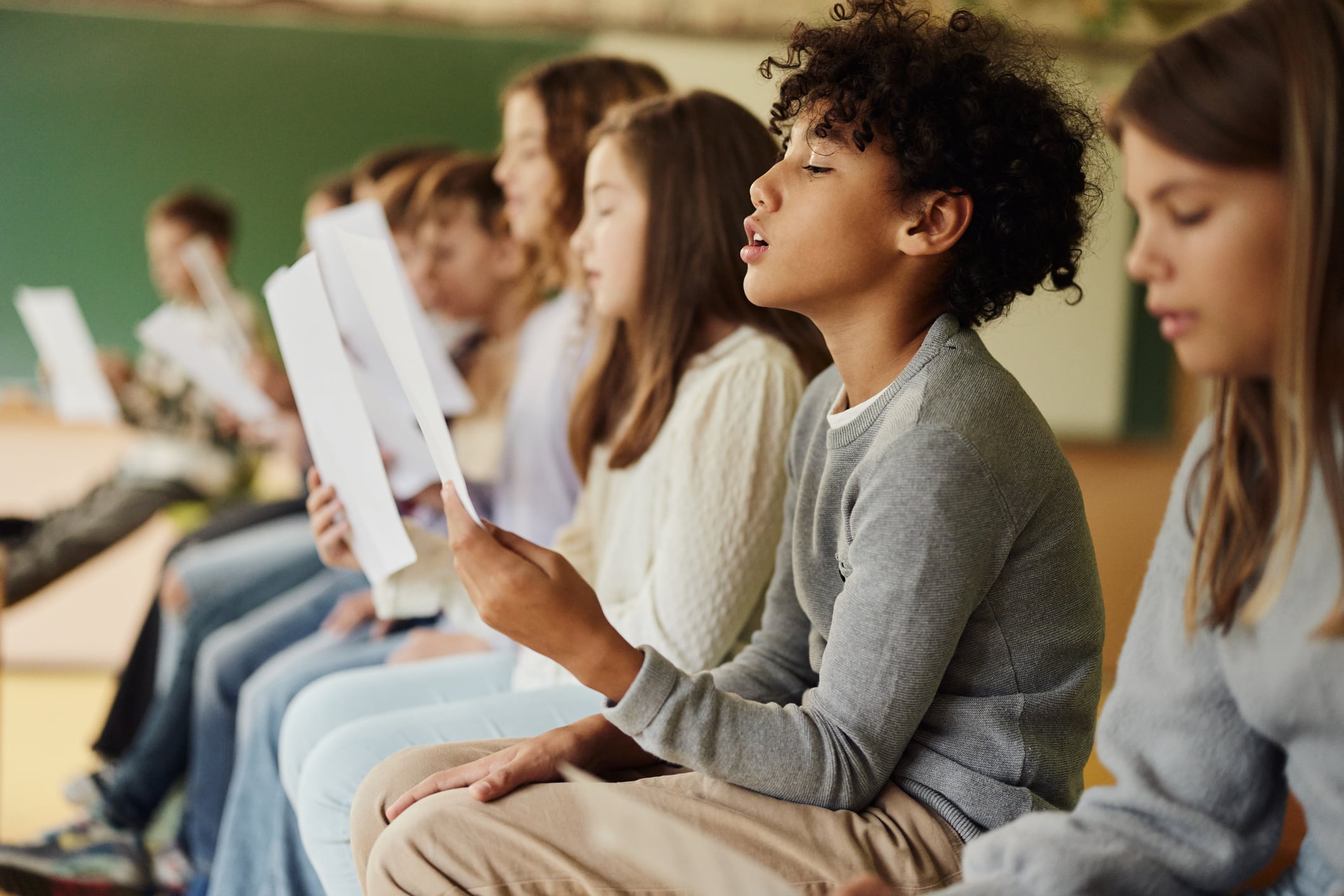 Children singing in classroom choir practice