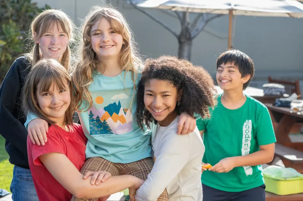 Group of happy children outdoors smiling together.