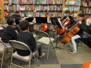 Students perform string quartet in bookstore.