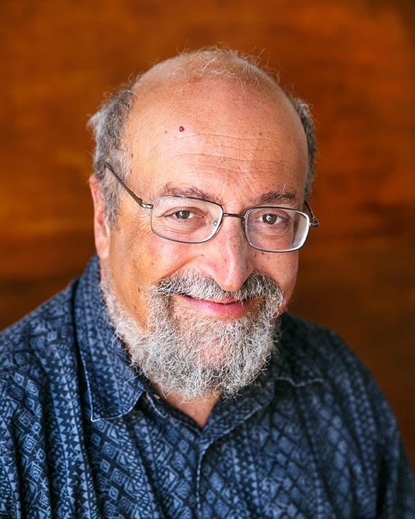 Smiling man with glasses and beard portrait