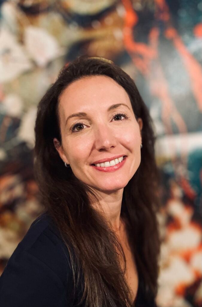 Smiling woman with colorful abstract background