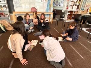 Children engaged in classroom group activity.