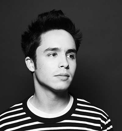 Person in striped shirt, black and white portrait.