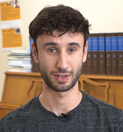 Person speaking in a library setting