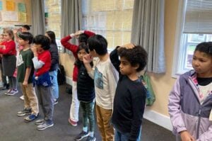 Children playing a game in a classroom