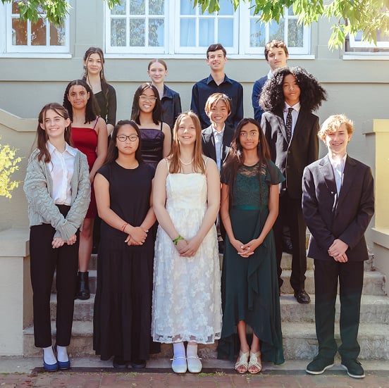 Group of students posing in formal attire