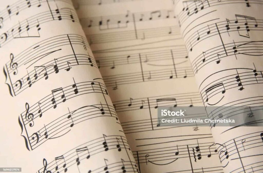 Close-up of sheet music with notes and symbols.
