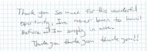 Handwritten thank you note on grid paper.
