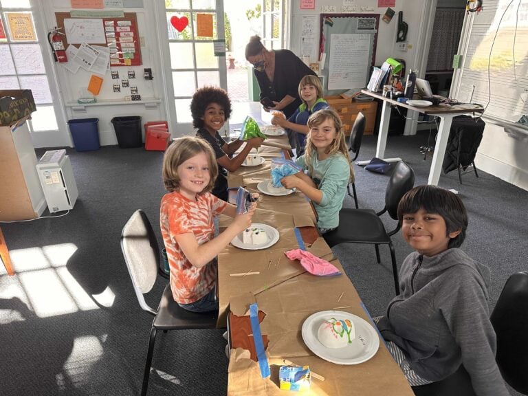 Children enjoying art activities in classroom setting.