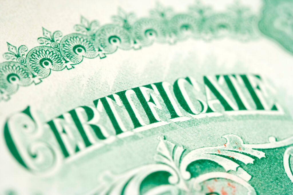 Close-up of green ornate certificate design.